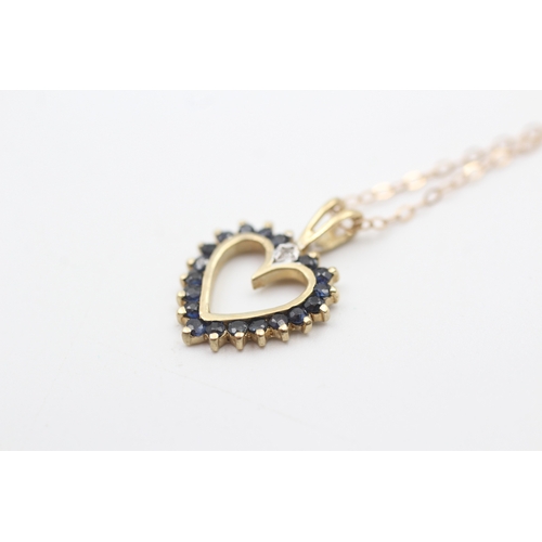 199 - 9ct gold sapphire set open heart pendant necklace (1.7g)