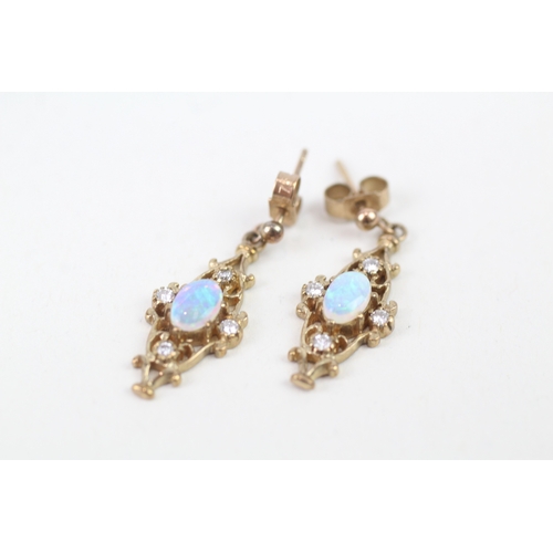 206 - 9ct gold opal and diamond set ornate drop earrings (2.7g)