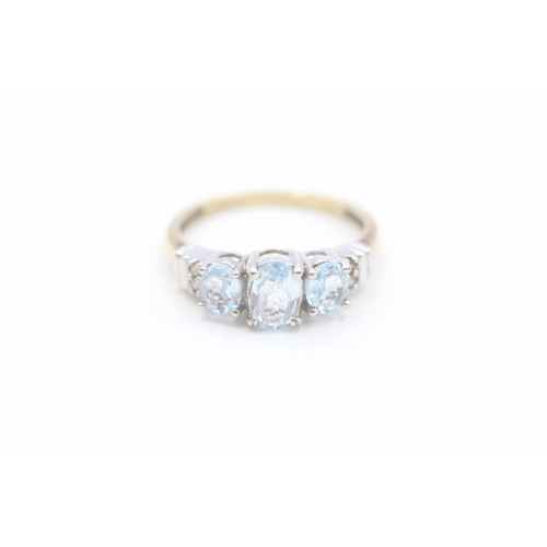 208 - 9ct gold diamond and blue topaz set dress ring (2.2g) Size  O