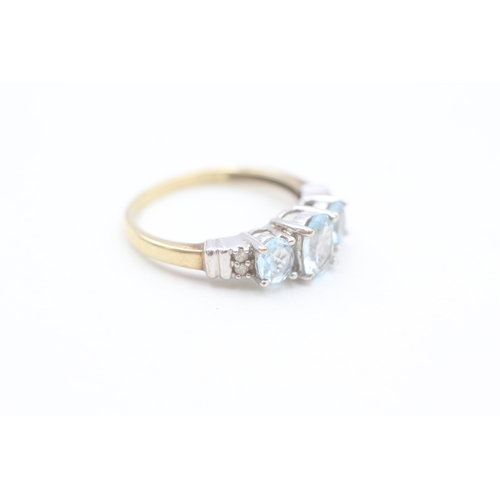 208 - 9ct gold diamond and blue topaz set dress ring (2.2g) Size  O