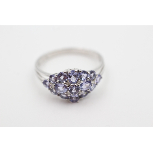 21 - 9ct white gold tanzanite and diamond set cluster ring (3.1g) Size  U