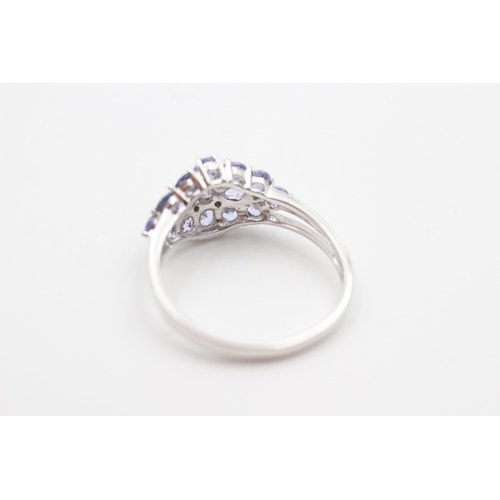 21 - 9ct white gold tanzanite and diamond set cluster ring (3.1g) Size  U