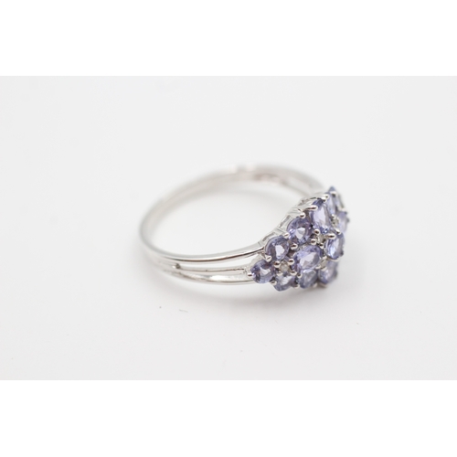 21 - 9ct white gold tanzanite and diamond set cluster ring (3.1g) Size  U