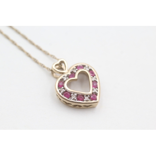 210 - 9ct gold diamond and ruby set open heart pendant necklace (3.1g)