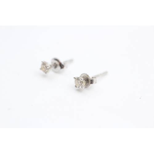 211 - 9ct white gold diamond set solitaire stud earrings (0.6g)