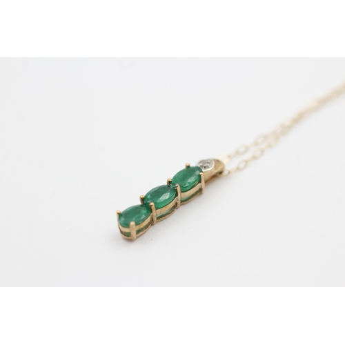 222 - 9ct gold diamond accented oval cut emerald trilogy pendant necklace (1.2g)