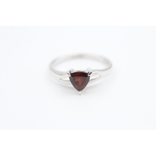 27 - 9ct white gold trilliant cut garnet set solitaire ring (2.3g) Size  N 1/2