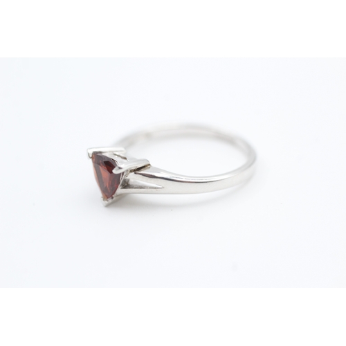 27 - 9ct white gold trilliant cut garnet set solitaire ring (2.3g) Size  N 1/2