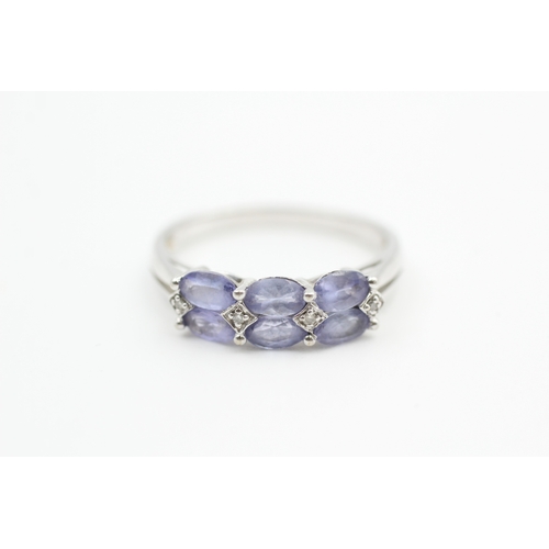 40 - 9ct white gold diamond accented tanzanite set dress ring (2.6g) Size  R