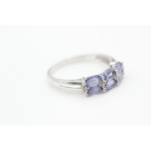 40 - 9ct white gold diamond accented tanzanite set dress ring (2.6g) Size  R