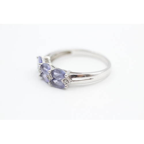 40 - 9ct white gold diamond accented tanzanite set dress ring (2.6g) Size  R