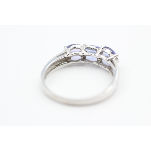 40 - 9ct white gold diamond accented tanzanite set dress ring (2.6g) Size  R