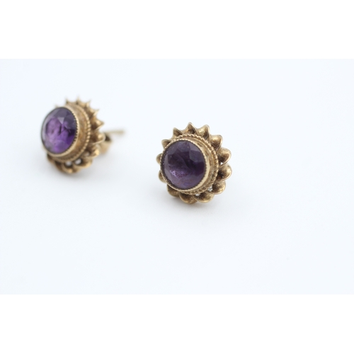 48 - 9ct gold rope twist amethyst stud earrings (2g)