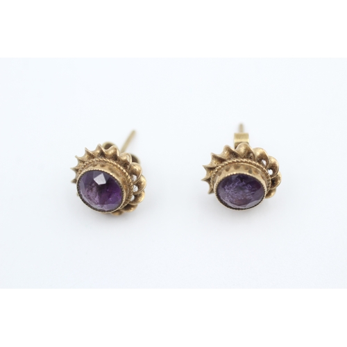 48 - 9ct gold rope twist amethyst stud earrings (2g)