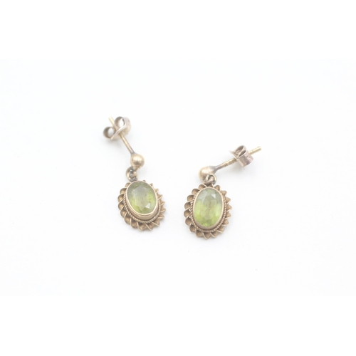 54 - 9ct gold rope framed oval cut peridot drop earrings (1.5g)