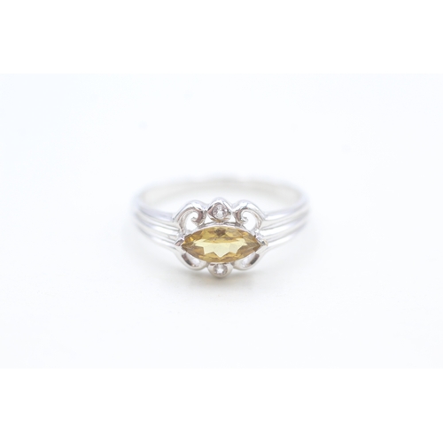 65 - 9ct white gold yellow tourmaline and white gemstone set dress ring (1.8g) Size  N 1/2