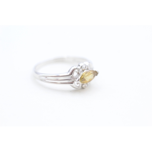 65 - 9ct white gold yellow tourmaline and white gemstone set dress ring (1.8g) Size  N 1/2