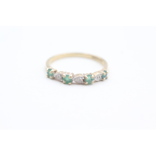 69 - 9ct gold diamond and emerald set seven stone eternity ring (1.5g) Size  P