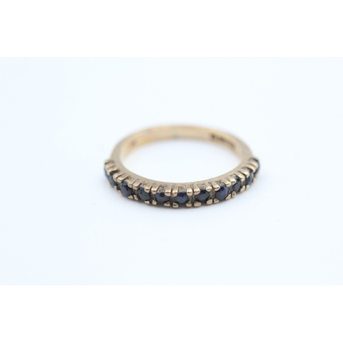 71 - 9ct gold sapphire set eleven stone set eternity ring (2g) Size  L