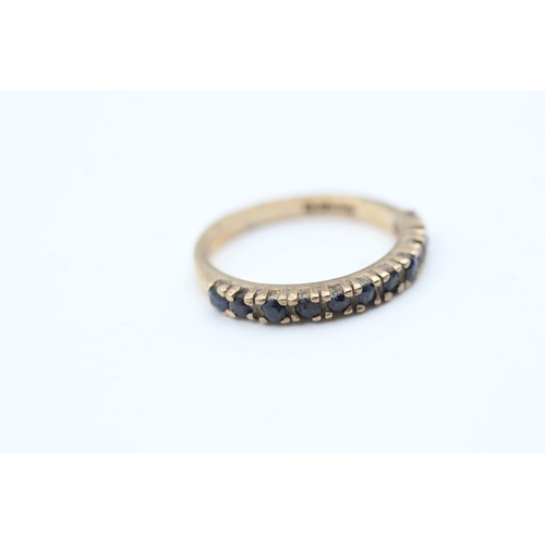 71 - 9ct gold sapphire set eleven stone set eternity ring (2g) Size  L