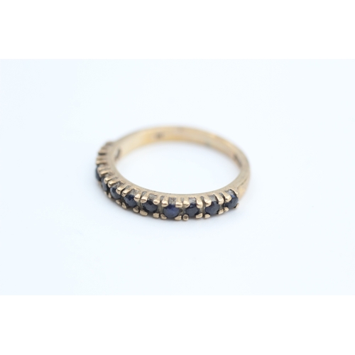 71 - 9ct gold sapphire set eleven stone set eternity ring (2g) Size  L