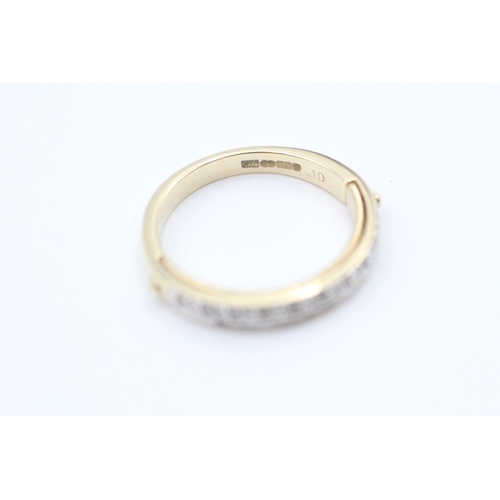 72 - 9ct gold diamond set half eternity ring - hidden message. (2.9g) Size  L