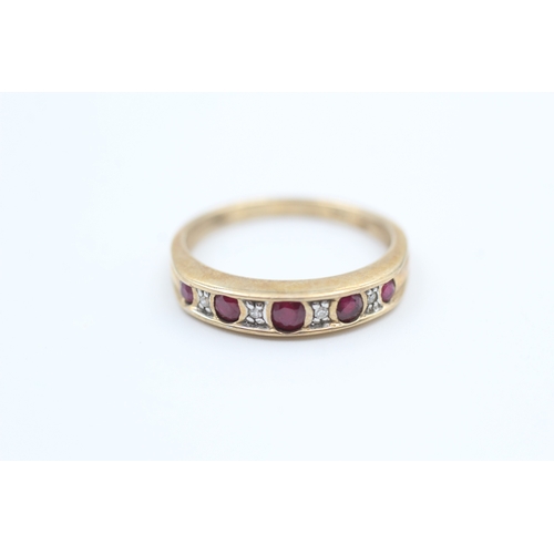 78 - 9ct gold diamond and ruby set nine stone eternity ring (2g) Size  N