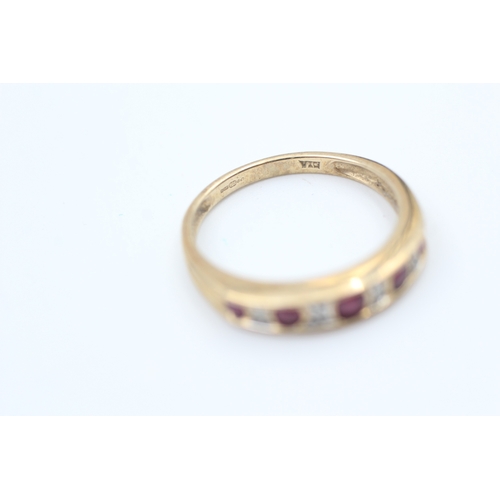 78 - 9ct gold diamond and ruby set nine stone eternity ring (2g) Size  N