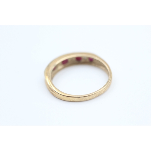 78 - 9ct gold diamond and ruby set nine stone eternity ring (2g) Size  N