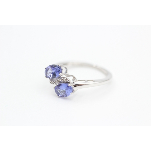 79 - 9ct white gold diamond and tanzanite bypass ring (1.8g) Size  K