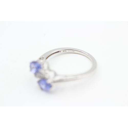 79 - 9ct white gold diamond and tanzanite bypass ring (1.8g) Size  K