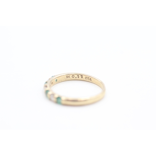 86 - 9ct gold diamond and emerald set seven stone eternity ring (1.6g) Size  L