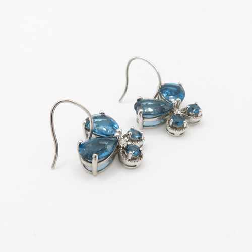 158 - 9ct gold blue topaz earrings (4g)