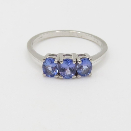 54 - 9ct gold tanzanite three stone ring (2.2g) Size  R 1/2