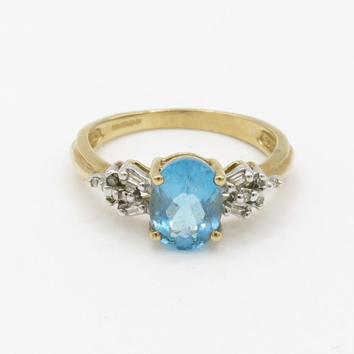 126 - 9ct gold diamond and blue topaz set dress ring (2.5g) Size  N