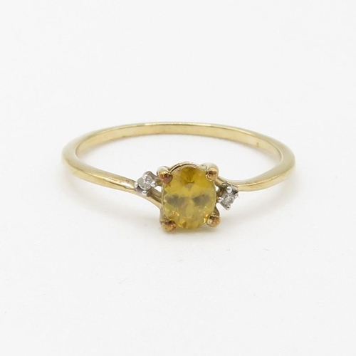 204 - 9ct gold delicate yellow gemstone and diamond set ring (0.8g) Size  M