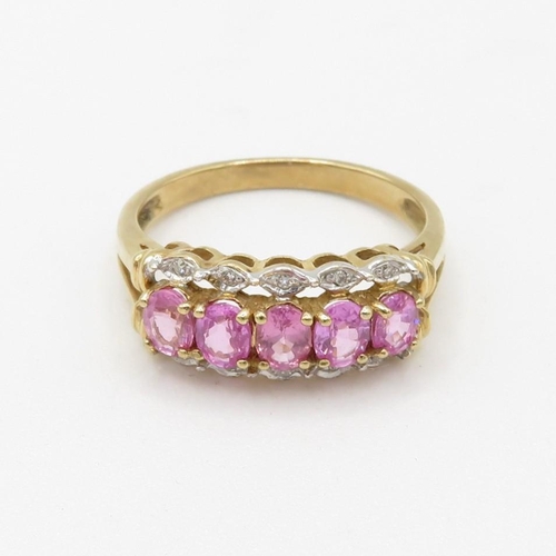 249 - 9ct gold pink sapphire five stone ring with diamond surround (2.6g) Size  N