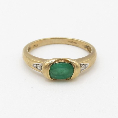 43 - 9ct gold emerald single stone ring with diamond set shoulders (1.9g) Size  L