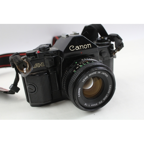 372 - Canon A-1 SLR Vintage Film Camera Black Working w/ Canon FD 50mm F/1.8 Lens