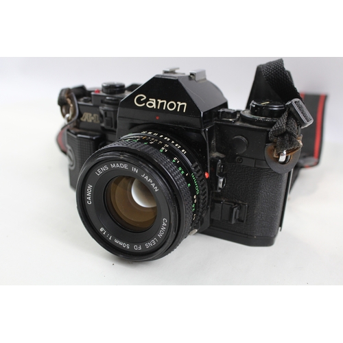 372 - Canon A-1 SLR Vintage Film Camera Black Working w/ Canon FD 50mm F/1.8 Lens