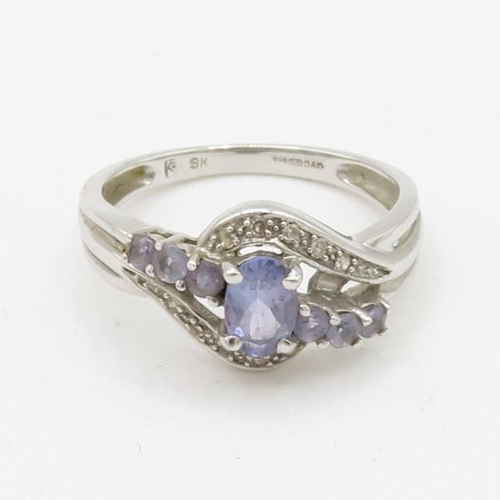 102 - 9ct white gold diamond accented tanzanite set dress ring (2.6g) Size  N