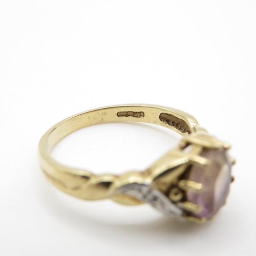 131 - 9ct gold diamond accented ametrine set dress ring (2.4g) Size  N