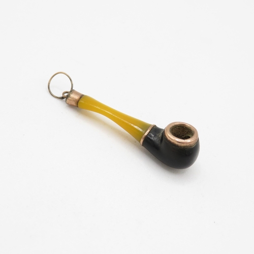 33 - 8ct gold and plastic pipe pendant (0.7g)