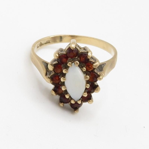 107 - 9ct gold garnet and opal set marquise shaped cluster ring (2.9g) Size  O