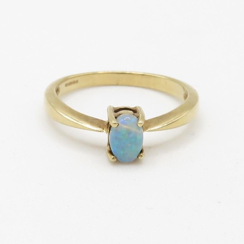 111 - 9ct gold claw set oval opal cabochon solitaire ring (2g) Size  N