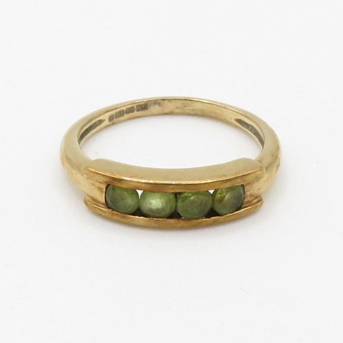 126 - 9ct gold channel set peridot four stone eternity ring (2.5g) Size  M