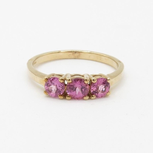 130 - 9ct gold pink garnet three stone ring (2.5g) Size  P 1/2