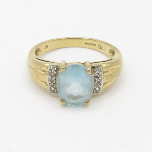 140 - 9ct gold diamond accented blue topaz set cocktail ring (3.2g) Size  M