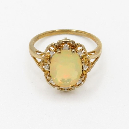 203 - 9ct gold diamond and opal set cluster ring (2.3g) Size  O