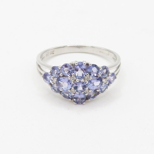 21 - 9ct white gold tanzanite and diamond set cluster ring (3.1g) Size  U